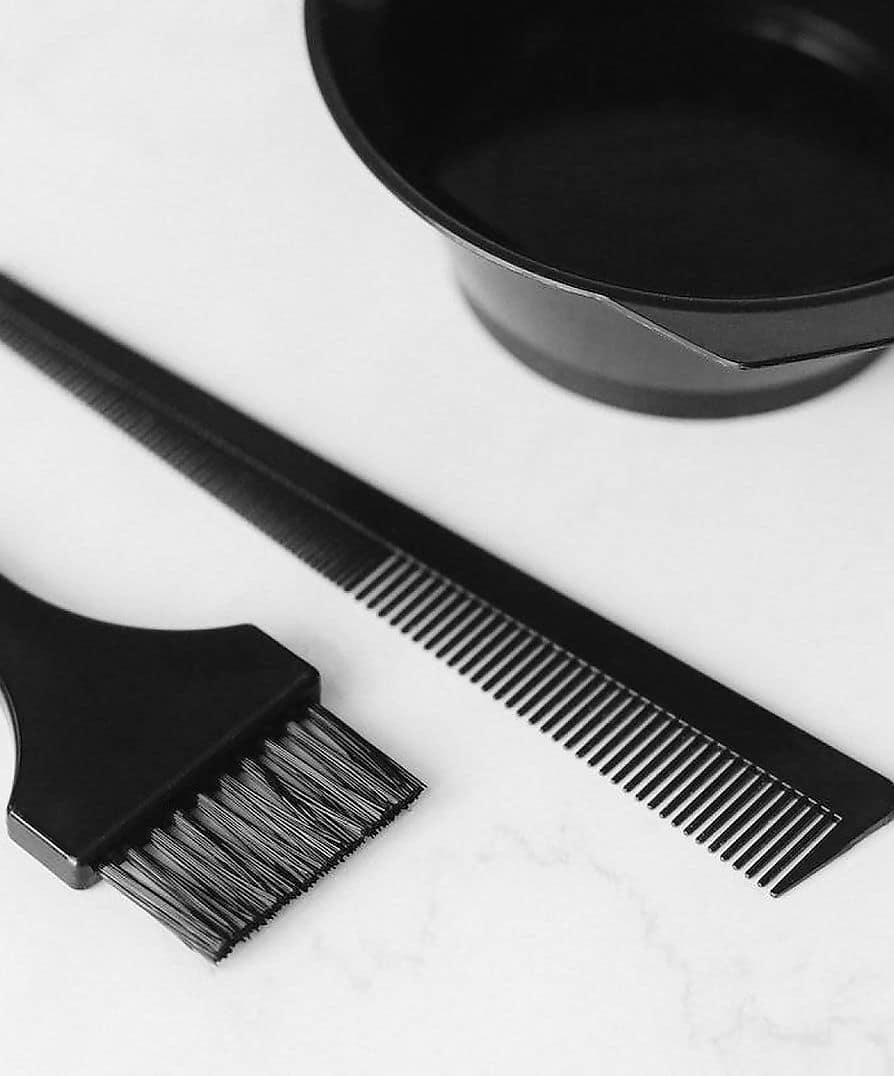 Hair-colouring tools — a tint brush, comb and bowl — at Therapy, Canterbury